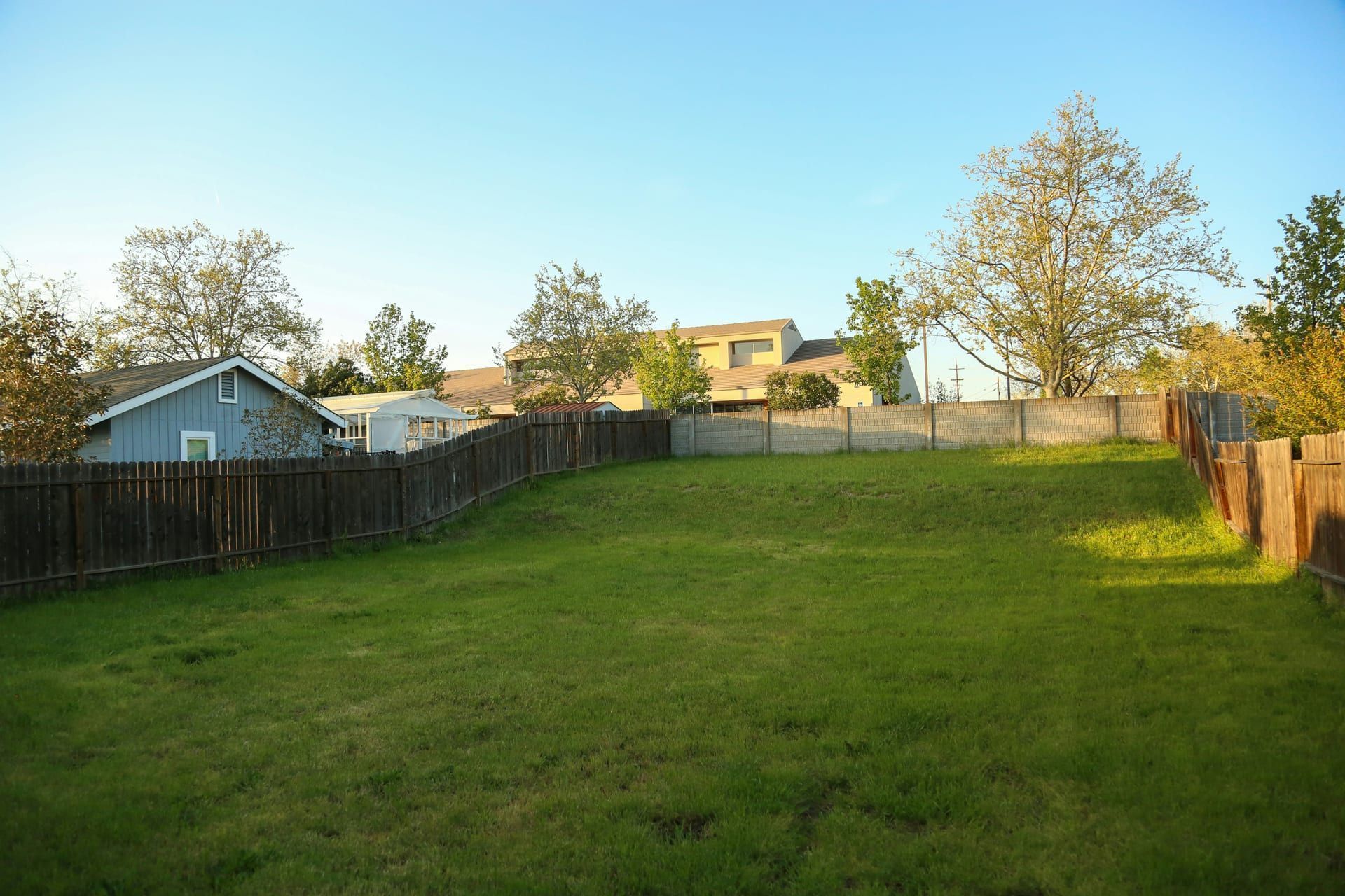 A fence following sloped ground in a yard